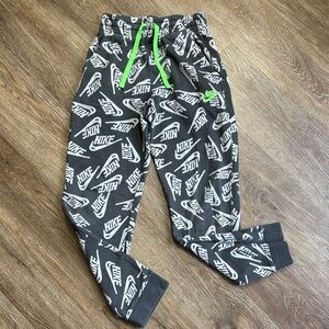 Nike Club Black Jogger Pants with White Logo Print and Neon Green Drawstring